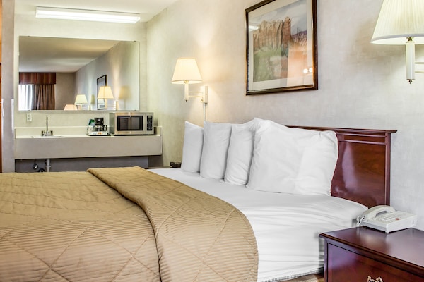 Premium bedding, pillow-top beds, laptop workspace, blackout curtains