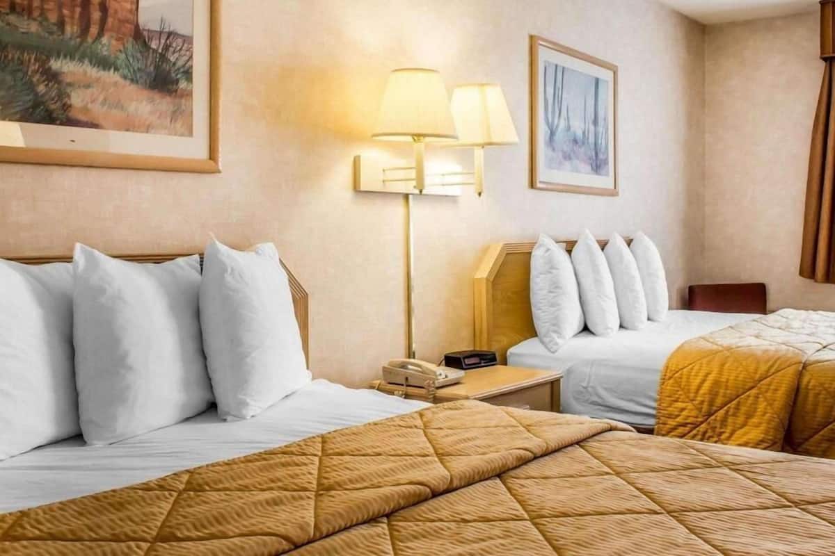 Premium bedding, pillowtop beds, laptop workspace, blackout drapes