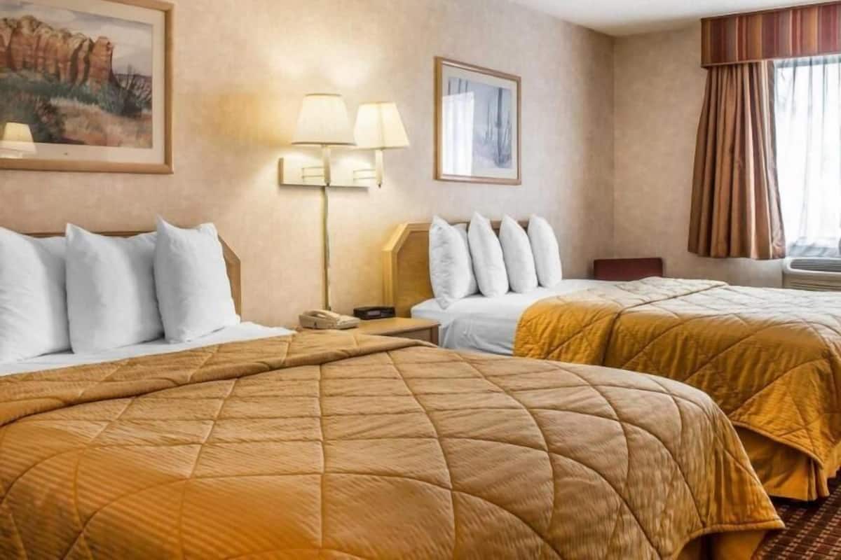 Premium bedding, pillowtop beds, laptop workspace, blackout drapes