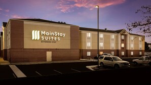 A MainStay Suites building with a brick facade and multiple windows. - MainStay Suites Denver Tech Center (Centennial)