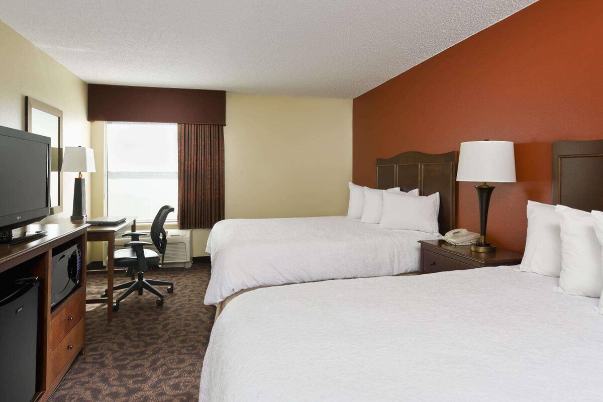 Premium bedding, pillow-top beds, desk, blackout curtains