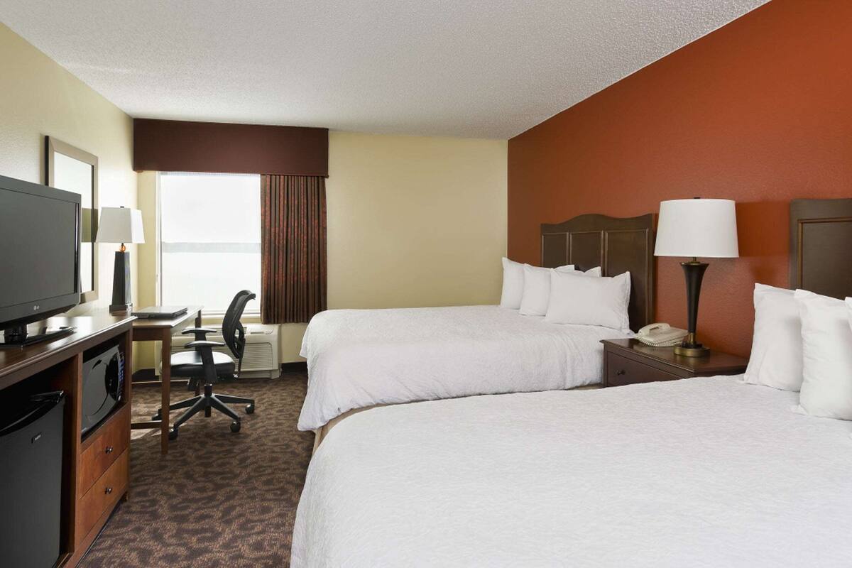 premium bedding, pillow-top beds, desk, blackout curtains