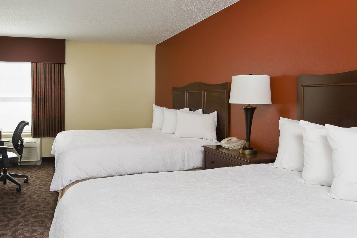 premium bedding, pillow-top beds, desk, blackout curtains