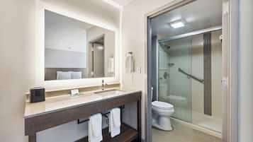 Combined shower/tub, designer toiletries, hair dryer, towels