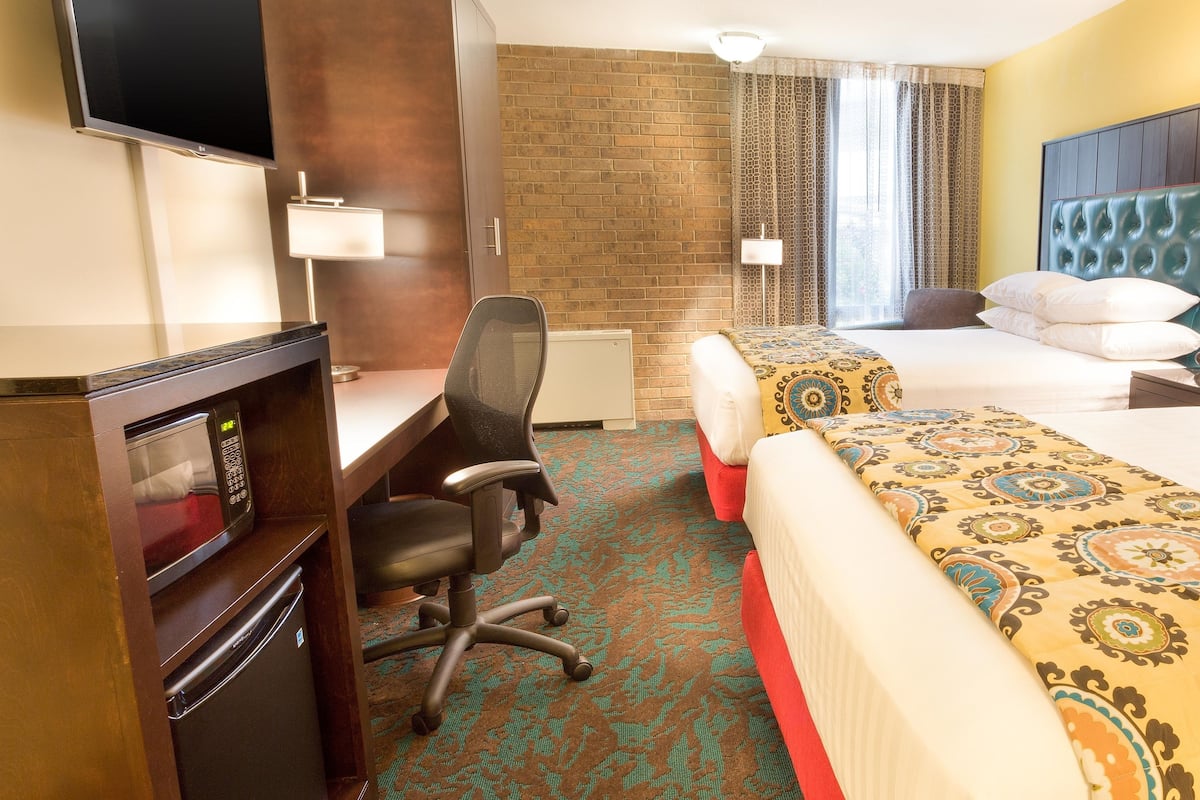 pillow-top beds, desk, blackout curtains, iron/ironing board