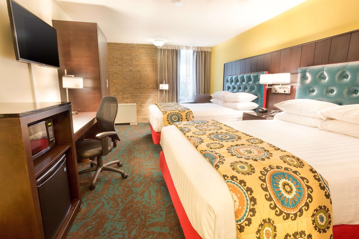 deluxe room, 2 queen beds, refrigerator & microwave | pillow-top beds, desk, blackout curtains, iron/ironing board