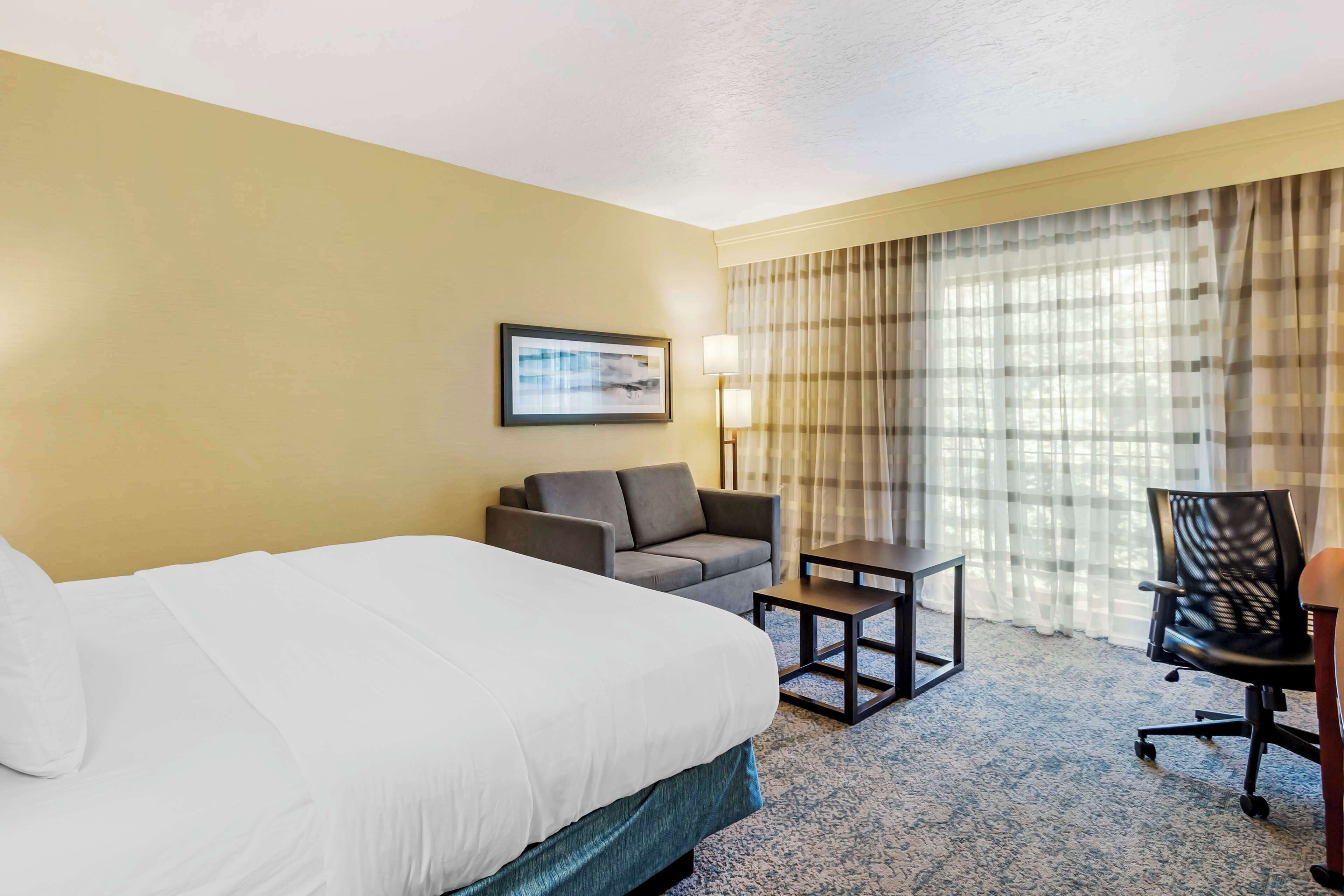 Premium bedding, pillow-top beds, desk, laptop workspace