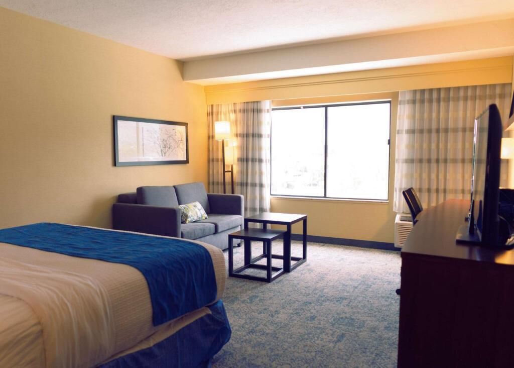 Premium bedding, pillow-top beds, desk, laptop workspace