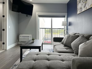 Family Suite with Jacuzzi | Living area | LED TV