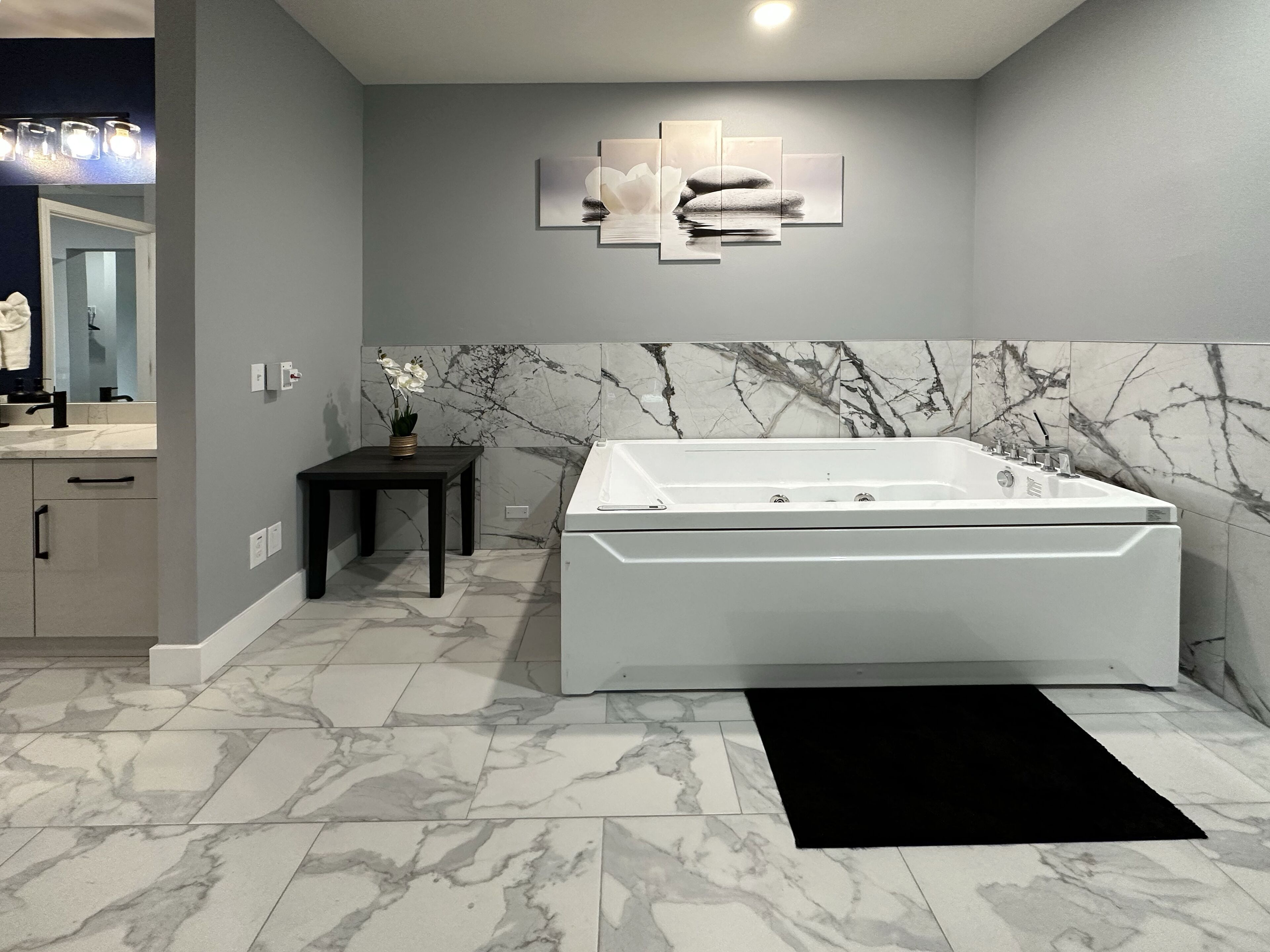 family suite with jacuzzi | bathroom | hair dryer, towels