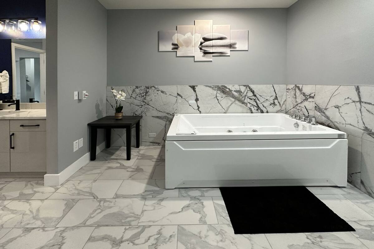 family suite with jacuzzi | bathroom | hair dryer, towels