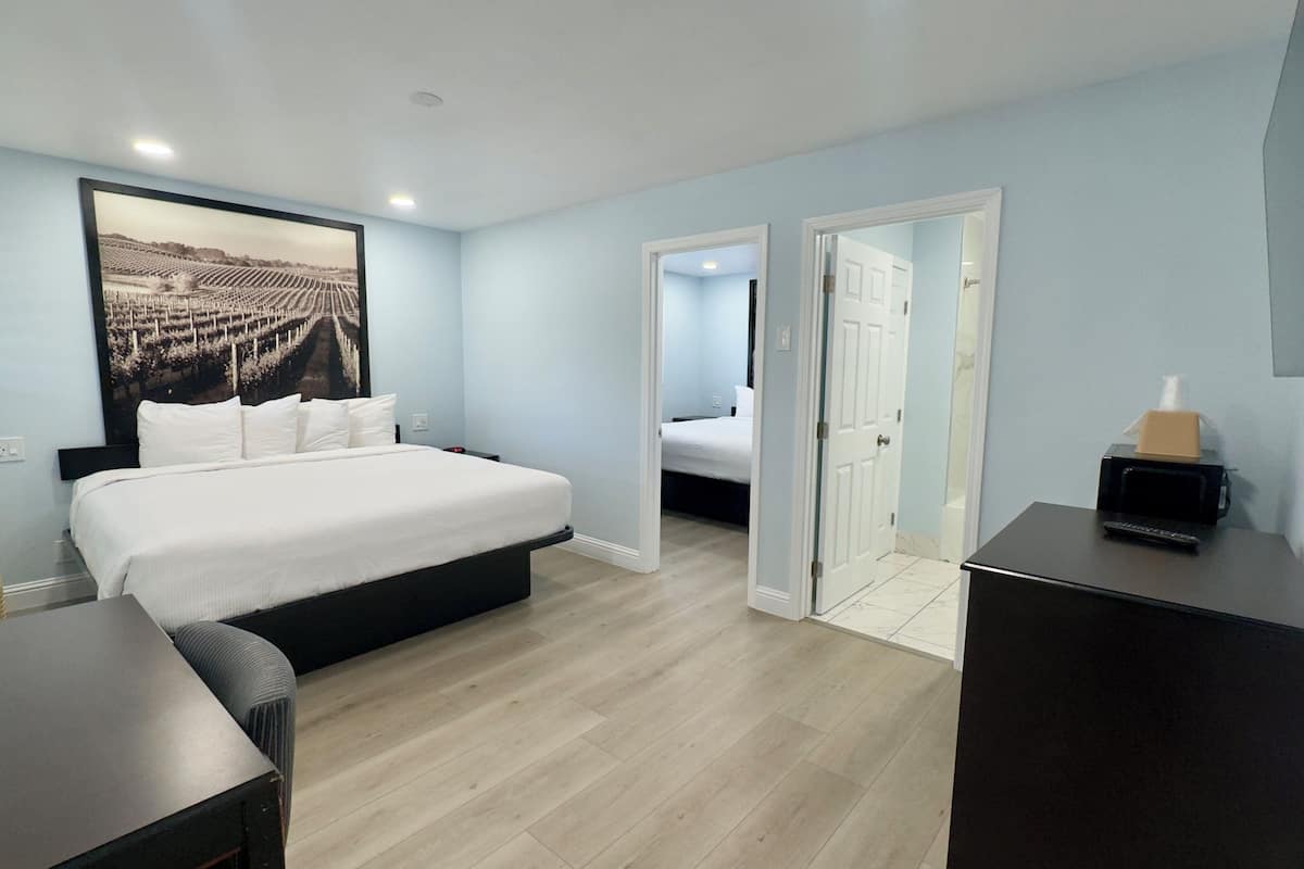 Suite, 2 Bedrooms | Desk, soundproofing, iron/ironing board, free WiFi