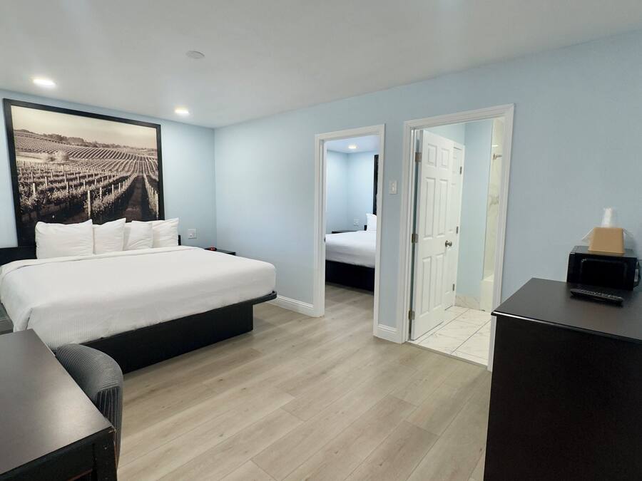 Suite, 2 Bedrooms | Desk, soundproofing, iron/ironing board, free WiFi