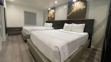 Suite Deluxe, 2 camas de matrimonio, no fumadores | Ropa de cama de alta calidad y edredones de plumas