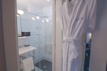 Combined shower/tub, designer toiletries, hair dryer, towels at The Frederick Hotel
