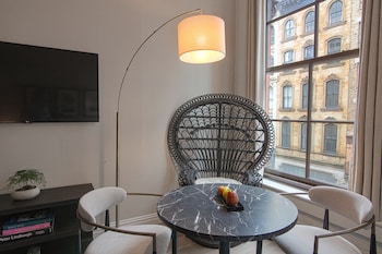 Suite, 1 King Bed with Sofa bed (Frederick) | Living area | 32-inch flat-screen TV with cable channels, TV, Netflix at The Frederick Hotel