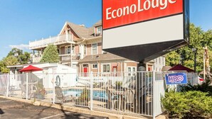 A large EconoLodge sign with a pool area visible in the background. - Econo Lodge Colorado Springs Downtown (Colorado Springs)