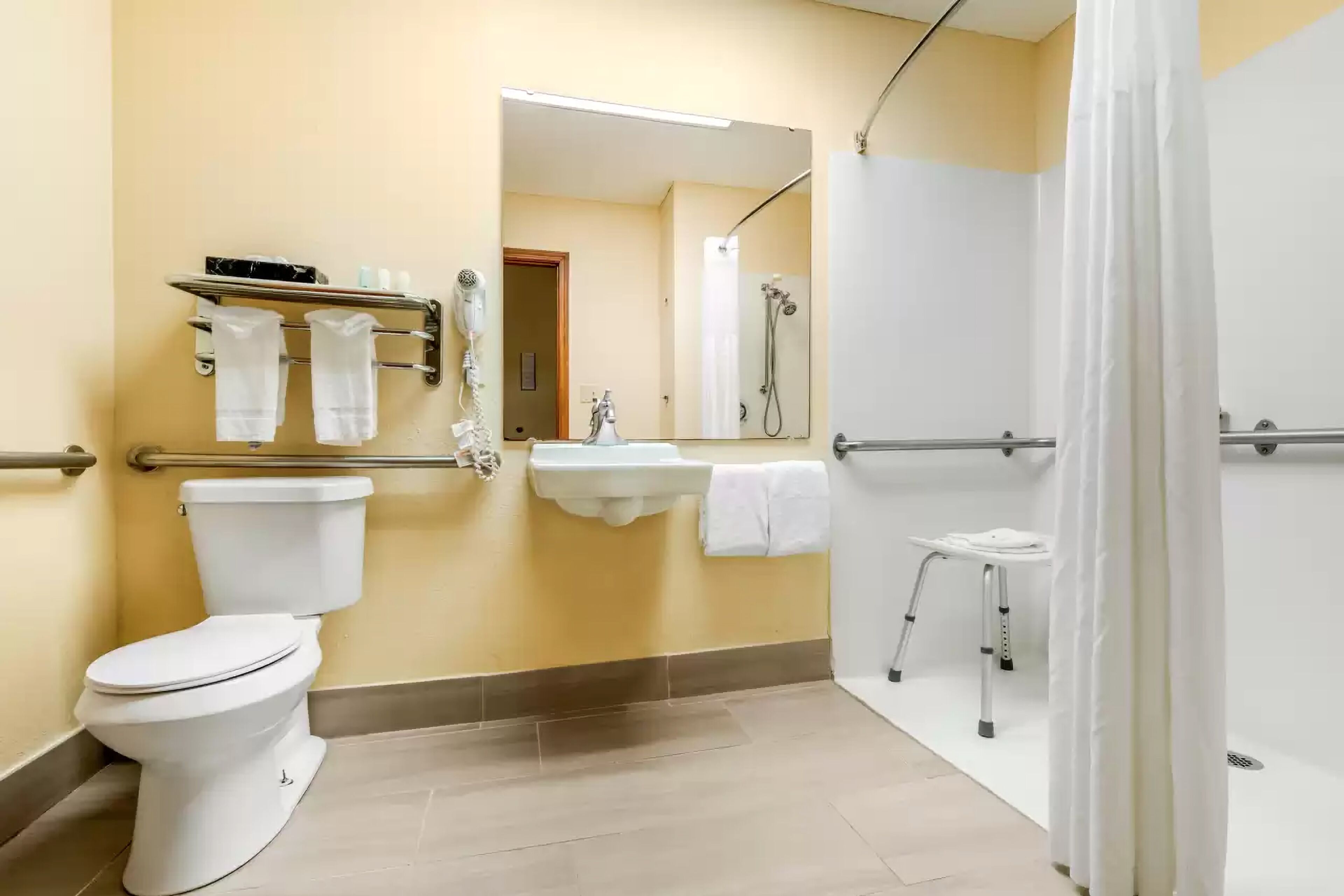 combined shower/bathtub, deep-soaking bathtub, hair dryer, towels