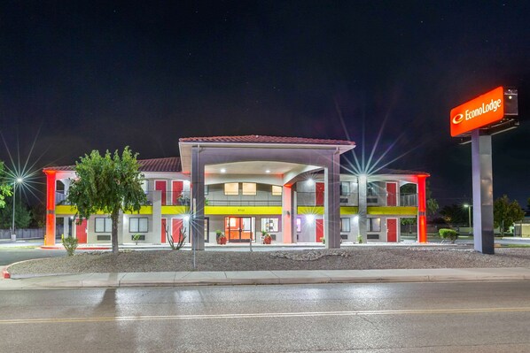 A brightly lit hotel with a modern design, featuring a prominent sign for EconoLodge.