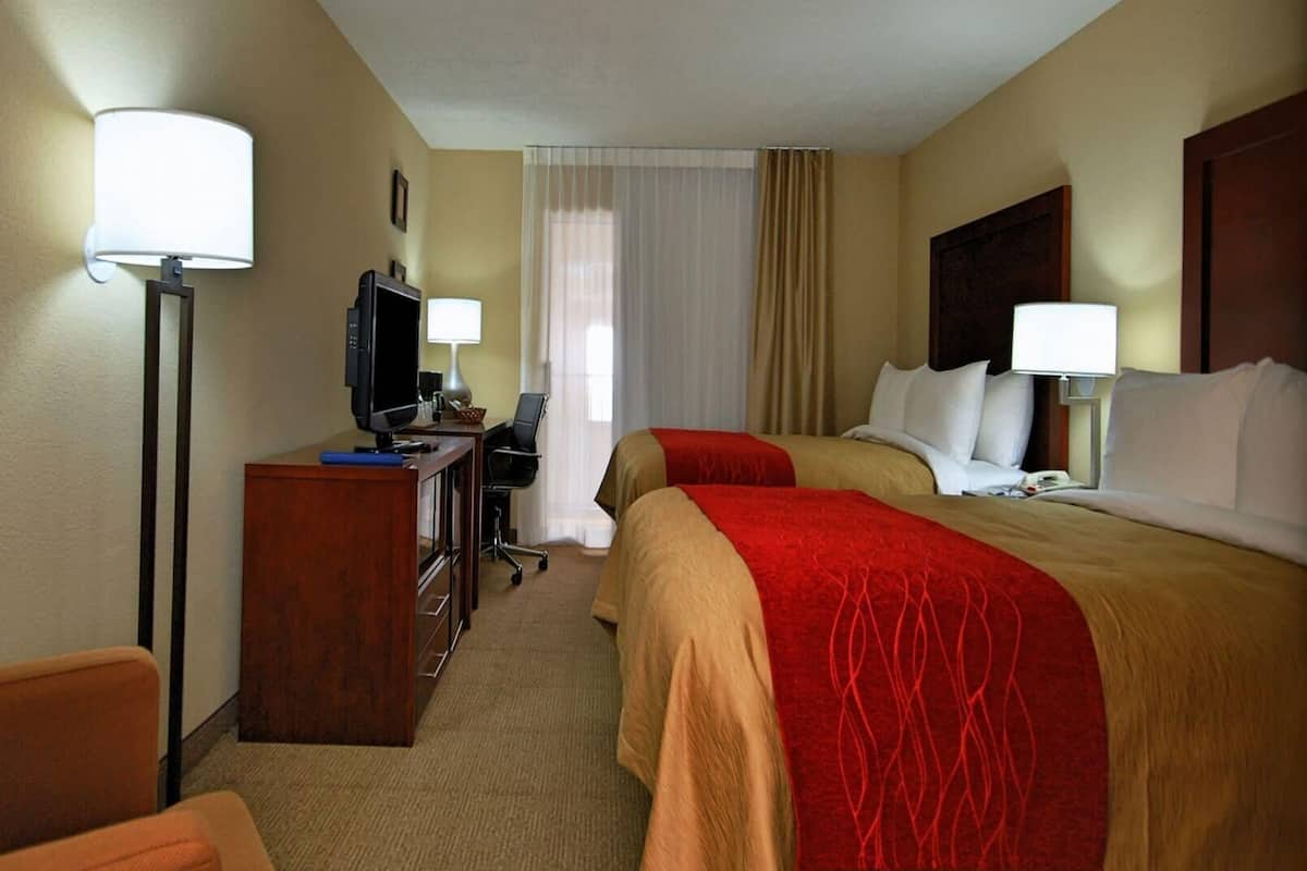 Premium bedding, pillow-top beds, desk, laptop workspace