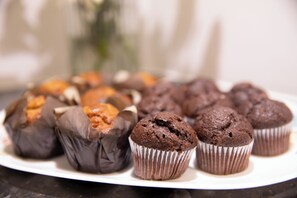 A plate of chocolate muffins and cookies. - Duke of Leinster (London)