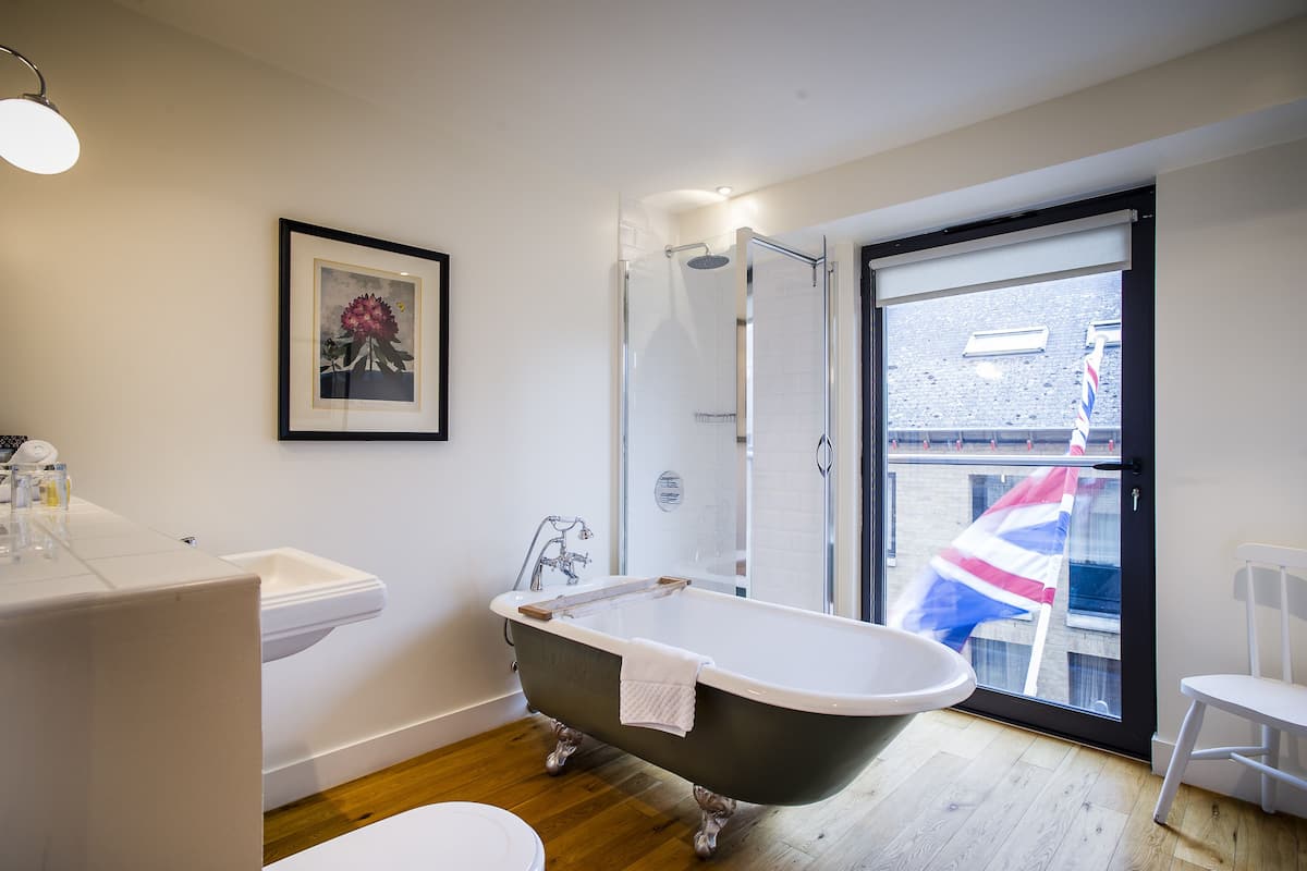 designer toiletries, hair dryer, bathrobes, slippers