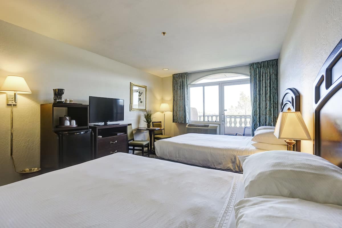 standard room, 2 queen beds | living area | 40-inch flat-screen tv with cable channels, tv