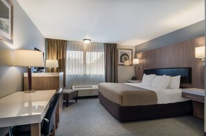 Suite, 1 King Bed, Non Smoking | Premium bedding, desk, blackout curtains, iron/ironing board