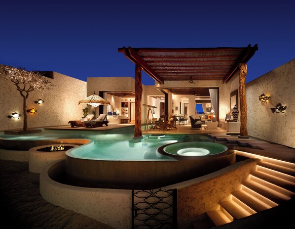 A pool area with a pergola, lounge chairs, and a staircase leading to a covered seating area. - Las Ventanas al Paraiso, A Rosewood Resort (San José del Cabo)