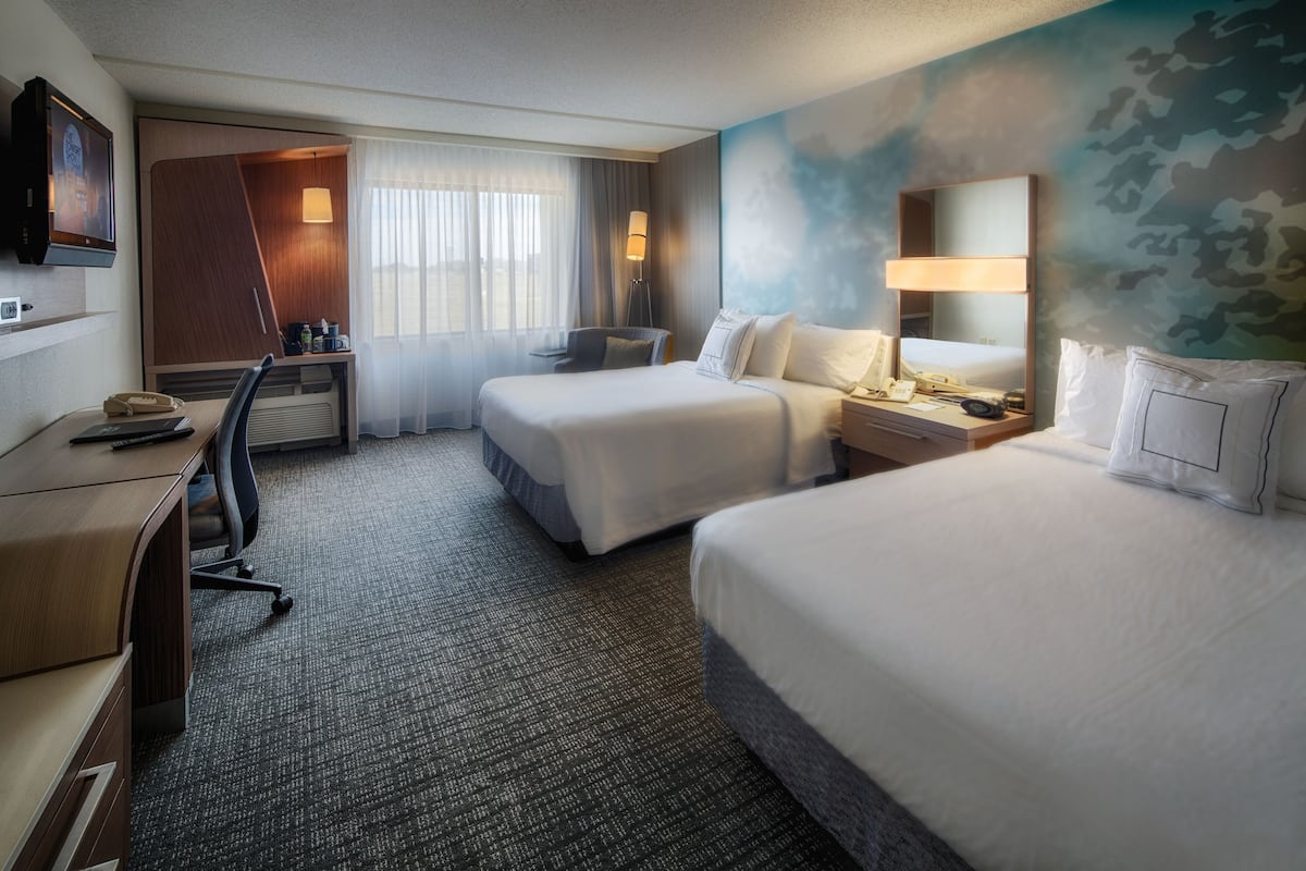 Pillow-top beds, desk, laptop workspace, blackout curtains