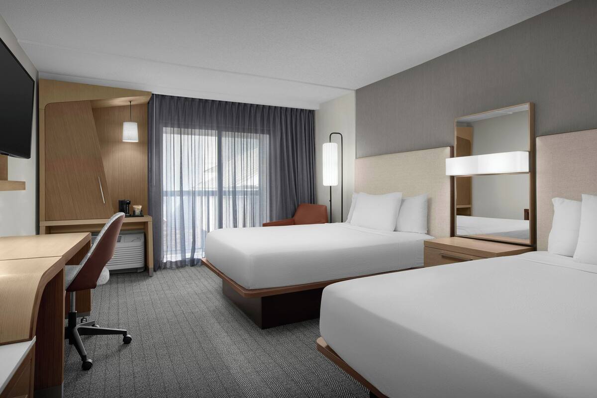 Pillow-top beds, desk, laptop workspace, blackout curtains
