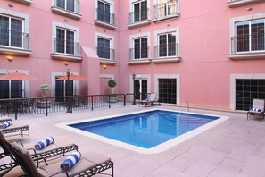 Outdoor pool, open 8 AM to 8 PM, pool loungers