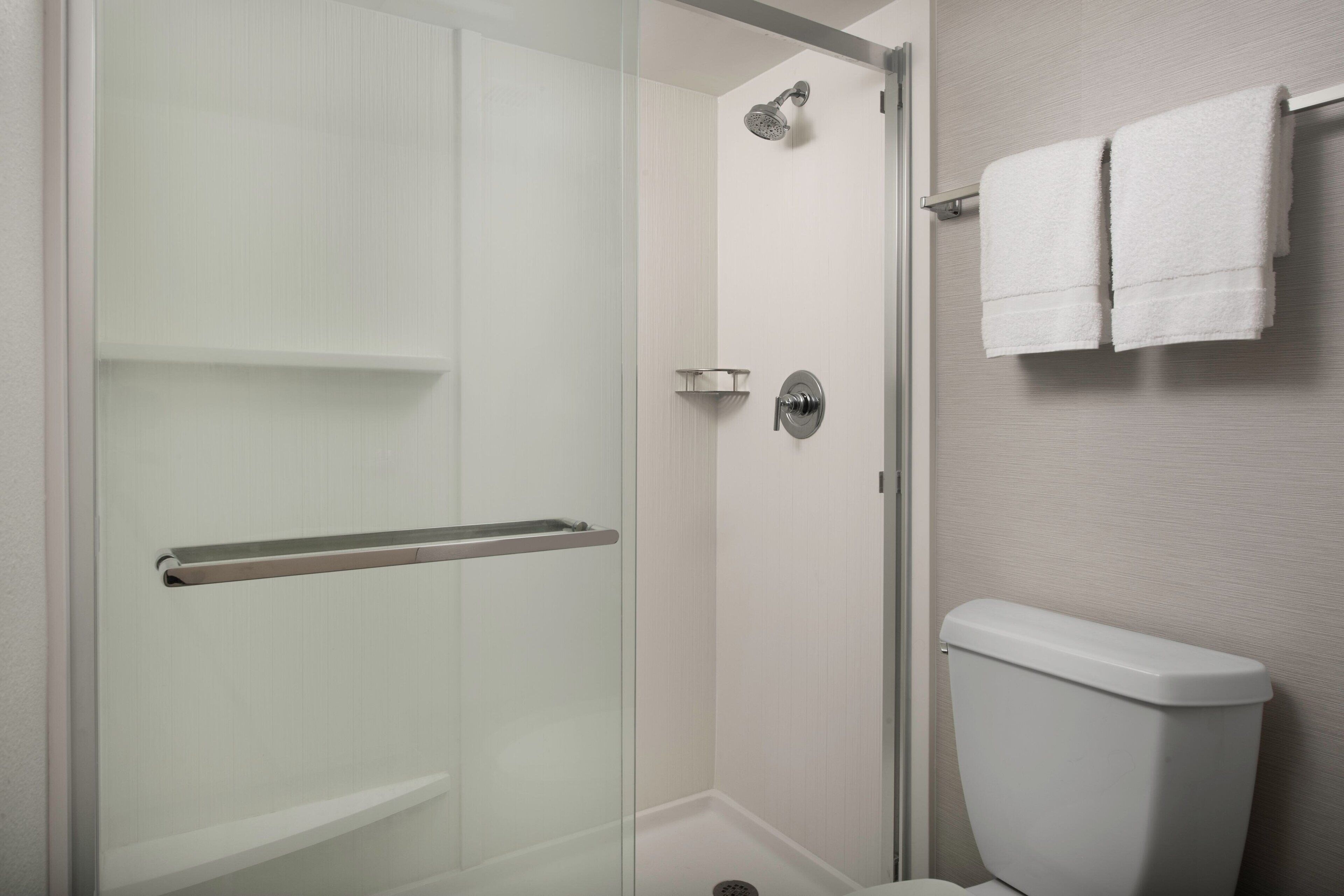 suite, 1 king bed with sofa bed, non smoking | bathroom | combined shower/bathtub, free toiletries, hair dryer, towels