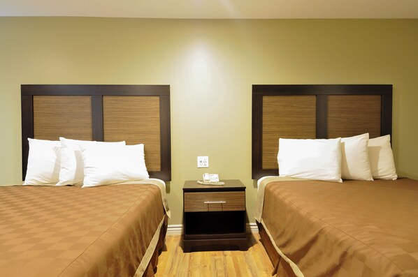 Quadruple Room, 2 Queen Beds, Accessible | In-room safe, desk, laptop workspace, blackout drapes