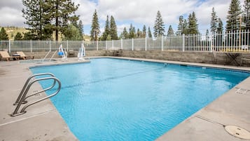 Seasonal outdoor pool, open 9:30 AM to 9:30 PM, pool umbrellas