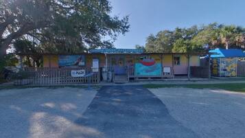A colorful building with a sign for Crystal River Watersports.