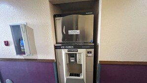 A vending machine for ice cubes with a sign instructing not to fill ice chests. - Motel 6 Deming, NM (Deming)