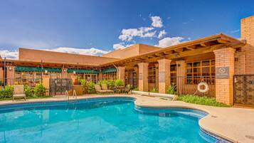 Outdoor pool, a heated pool, open 8:00 AM to 11:00 PM, pool loungers