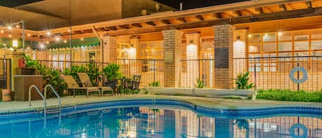 Outdoor pool, a heated pool, open 8:00 AM to 11:00 PM, pool loungers