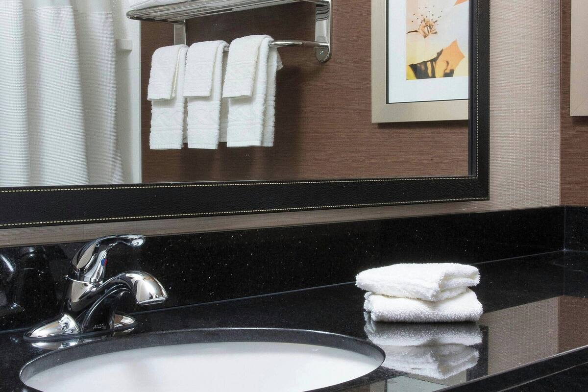 room, 2 queen beds | bathroom | combined shower/bathtub, designer toiletries, towels