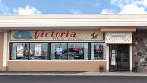 A restaurant named Victoria with a 'Welcome' sign, a video gaming sign, and an ATM sign. - Super 8 by Wyndham Chicago Northlake O'Hare South (Northlake)