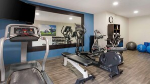 A gym with treadmills, elliptical machines, and free weights. - Best Western Heartland Inn (Mattoon)