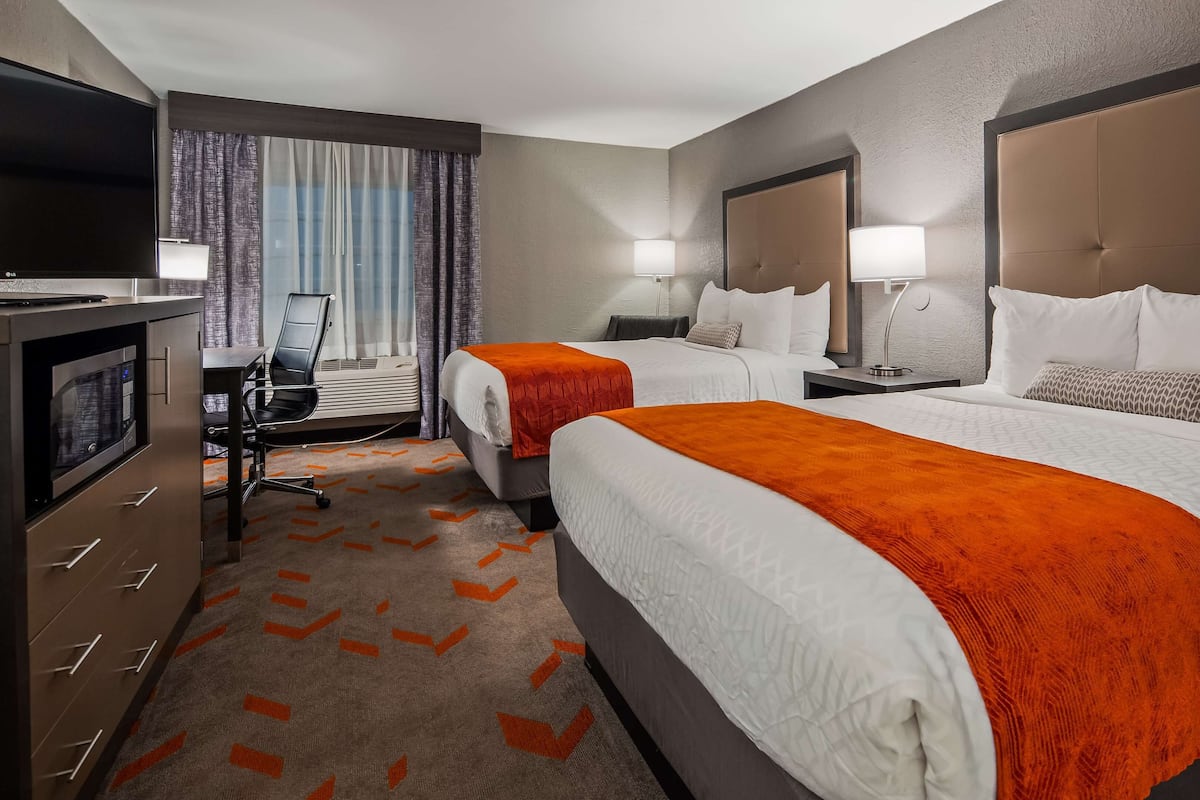 Hypo-allergenic bedding, desk, laptop workspace, blackout curtains