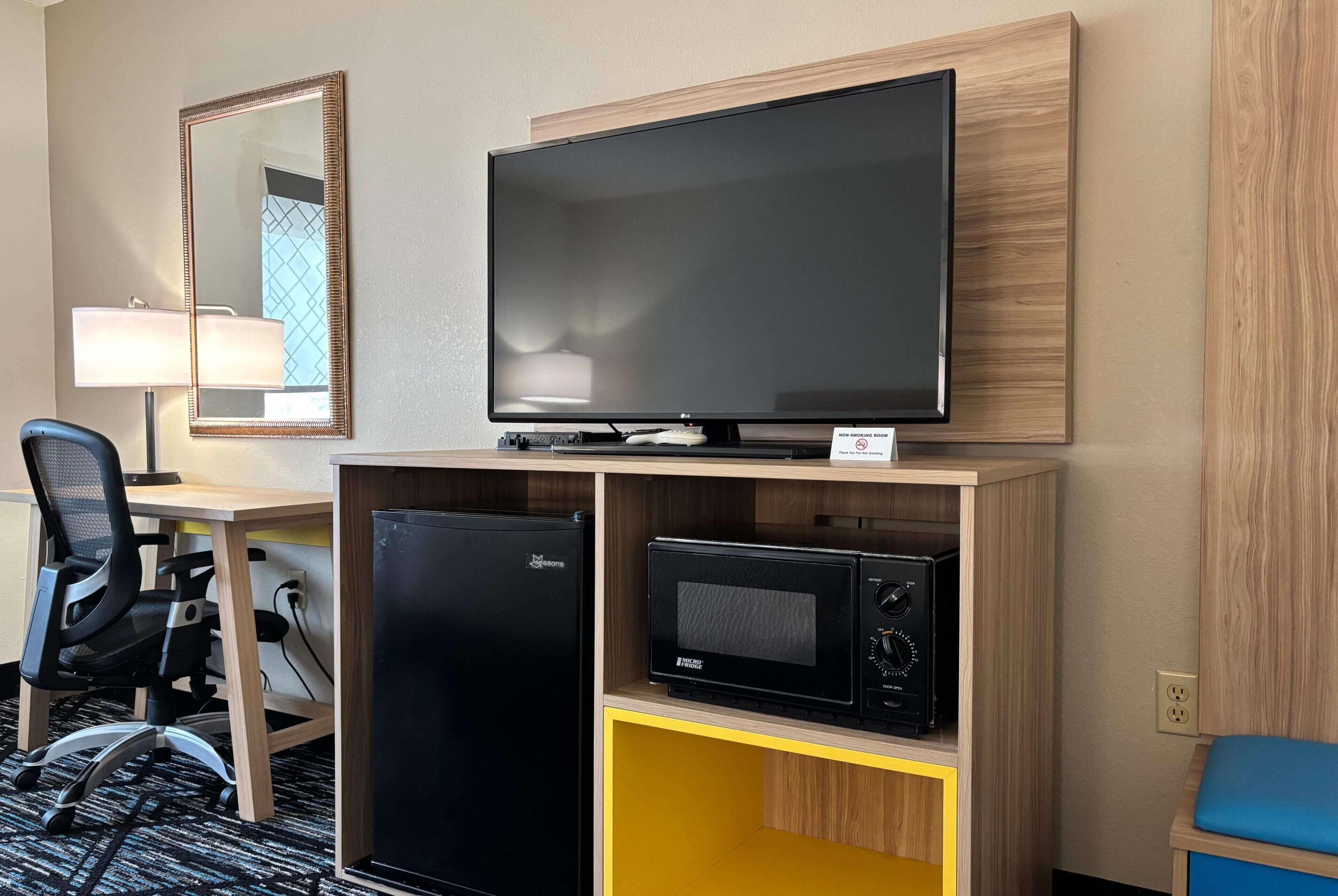 Desk, laptop workspace, iron/ironing board, free cribs/infant beds