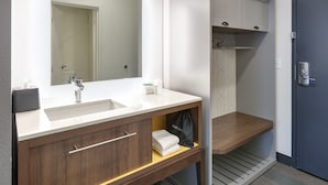 A modern bathroom with a white sink, wooden vanity, and a mirror above the sink. - Holiday Inn Twin Falls by IHG (Twin Falls)