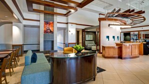 A spacious lobby with a reception desk, seating area, and a kitchen in the background. - Hyatt Place Baltimore/BWI Airport (Linthicum Heights)