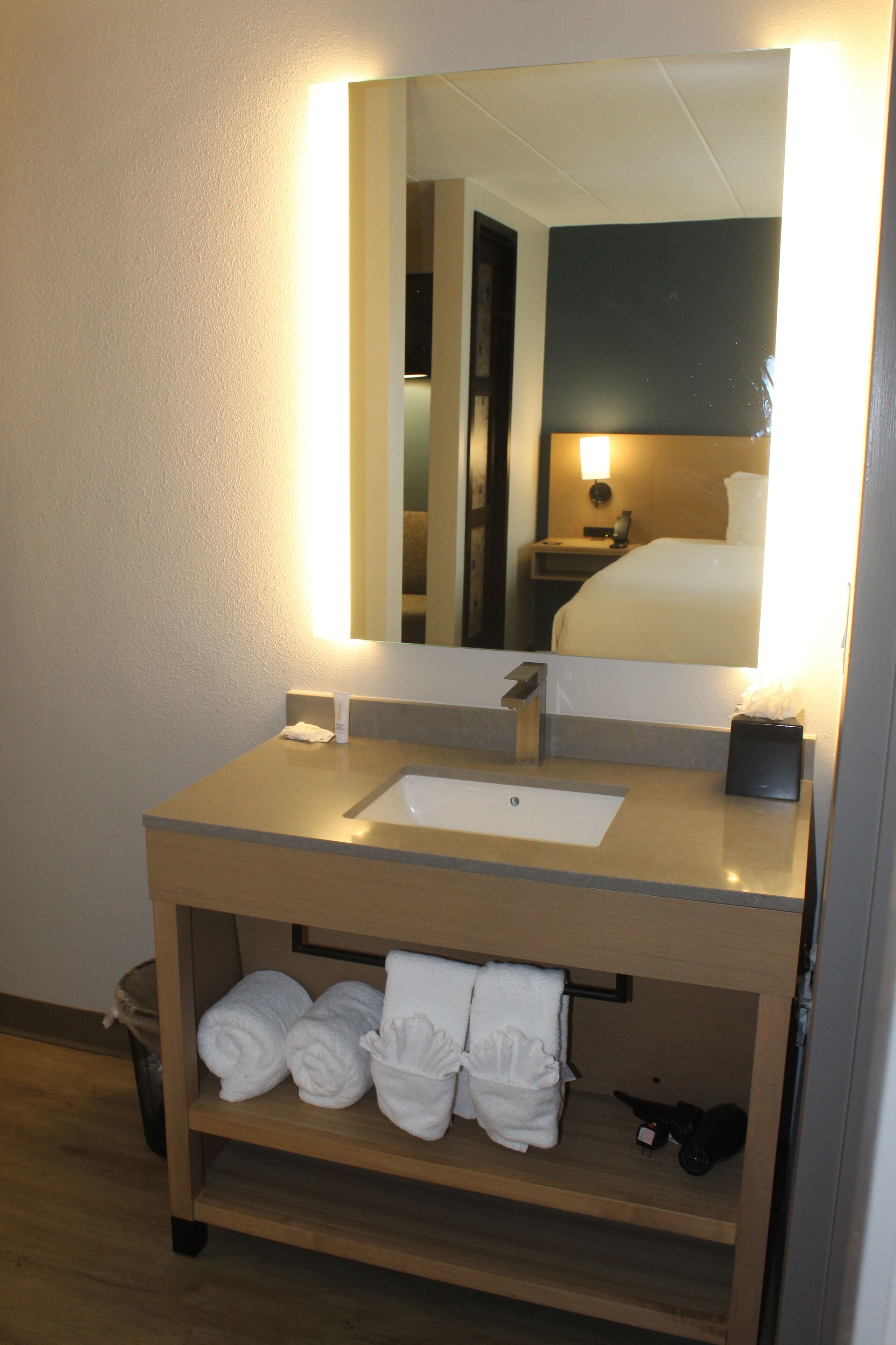 combined shower/bathtub, designer toiletries, hair dryer, towels