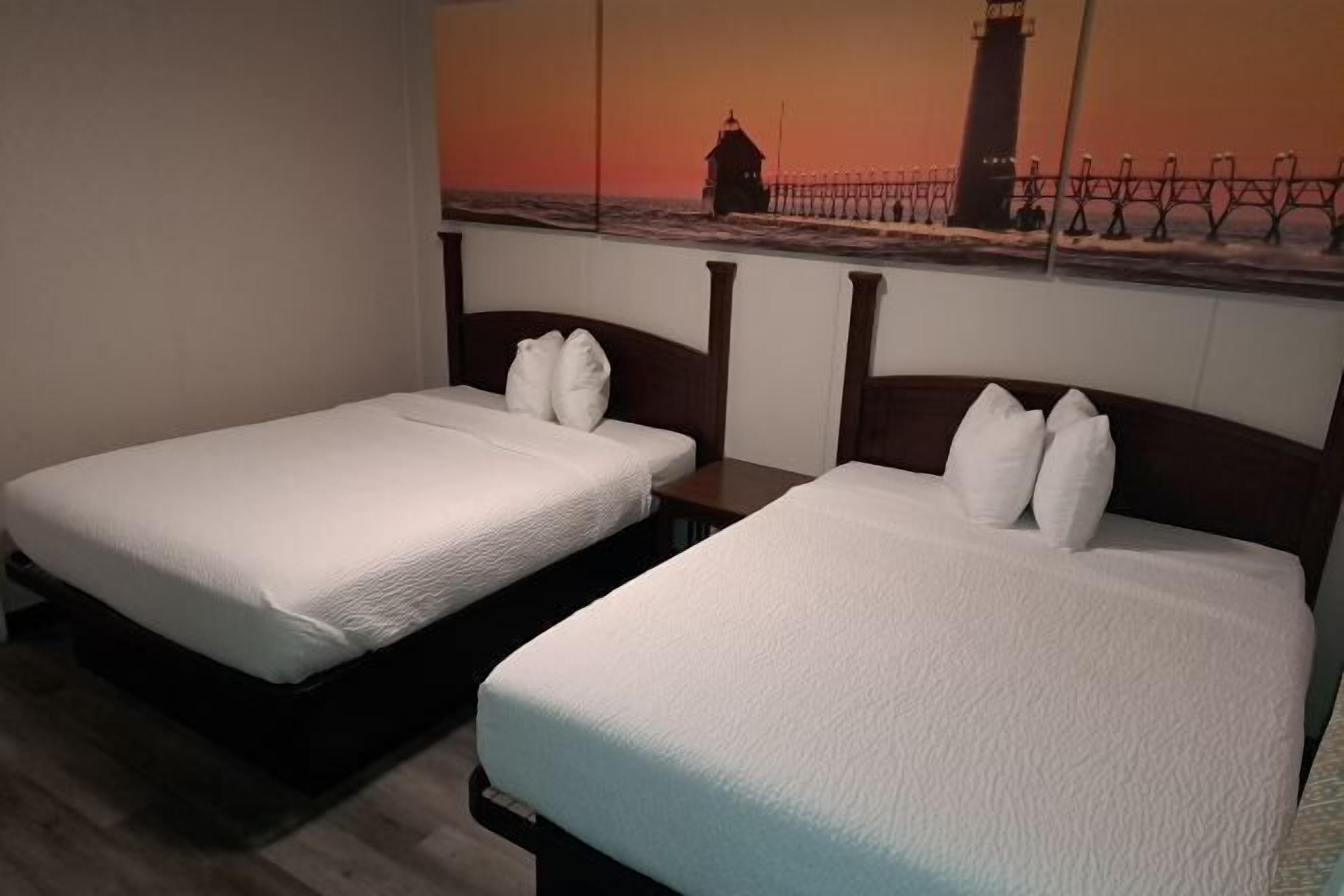 Laptop workspace, blackout drapes, iron/ironing board, rollaway beds