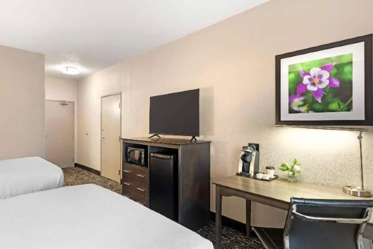 Premium bedding, pillow-top beds, desk, laptop workspace