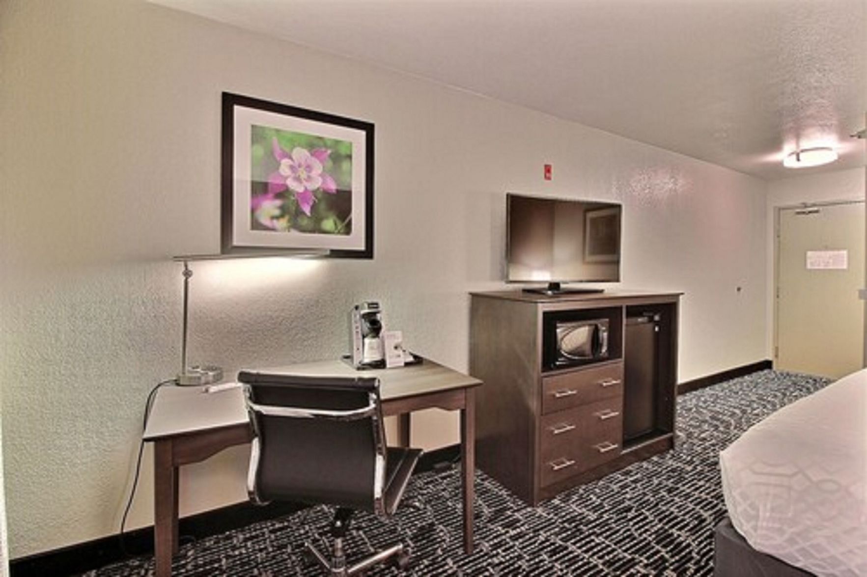 Premium bedding, pillow-top beds, desk, laptop workspace